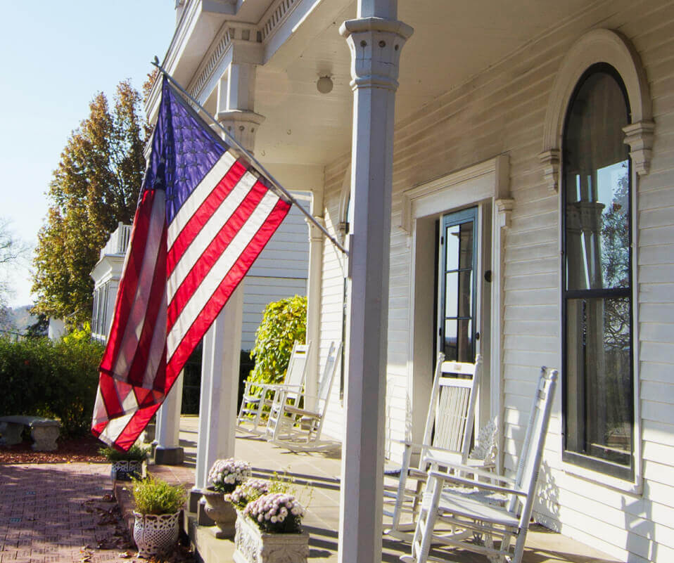 image of an American flag on a front porch