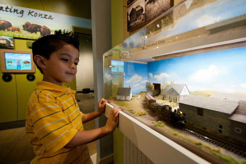 Kansas tourism boy watching train in museum