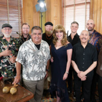 Son Venezuela performs at the Kansas State Capitol for the 2024 LG Desk Concerts. Also pictured is LG Desk Concerts Host Sierra Scott