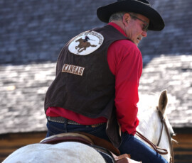 Pony Express rider outside an old station house.