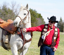 A rider guides his horse.