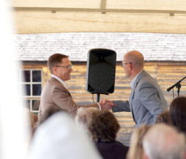 Lt. Governor Toland and Sec. Reed shake hands.