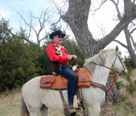 A rider on a white horse.