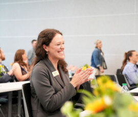 Individual at the HEAL 6.0 award presentation.