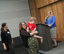 Individuals on stage at the HEAL 6.0 award presentation.