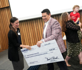 Individuals on stage at the HEAL 6.0 award presentation.