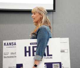 Individuals on stage at the HEAL 6.0 award presentation.